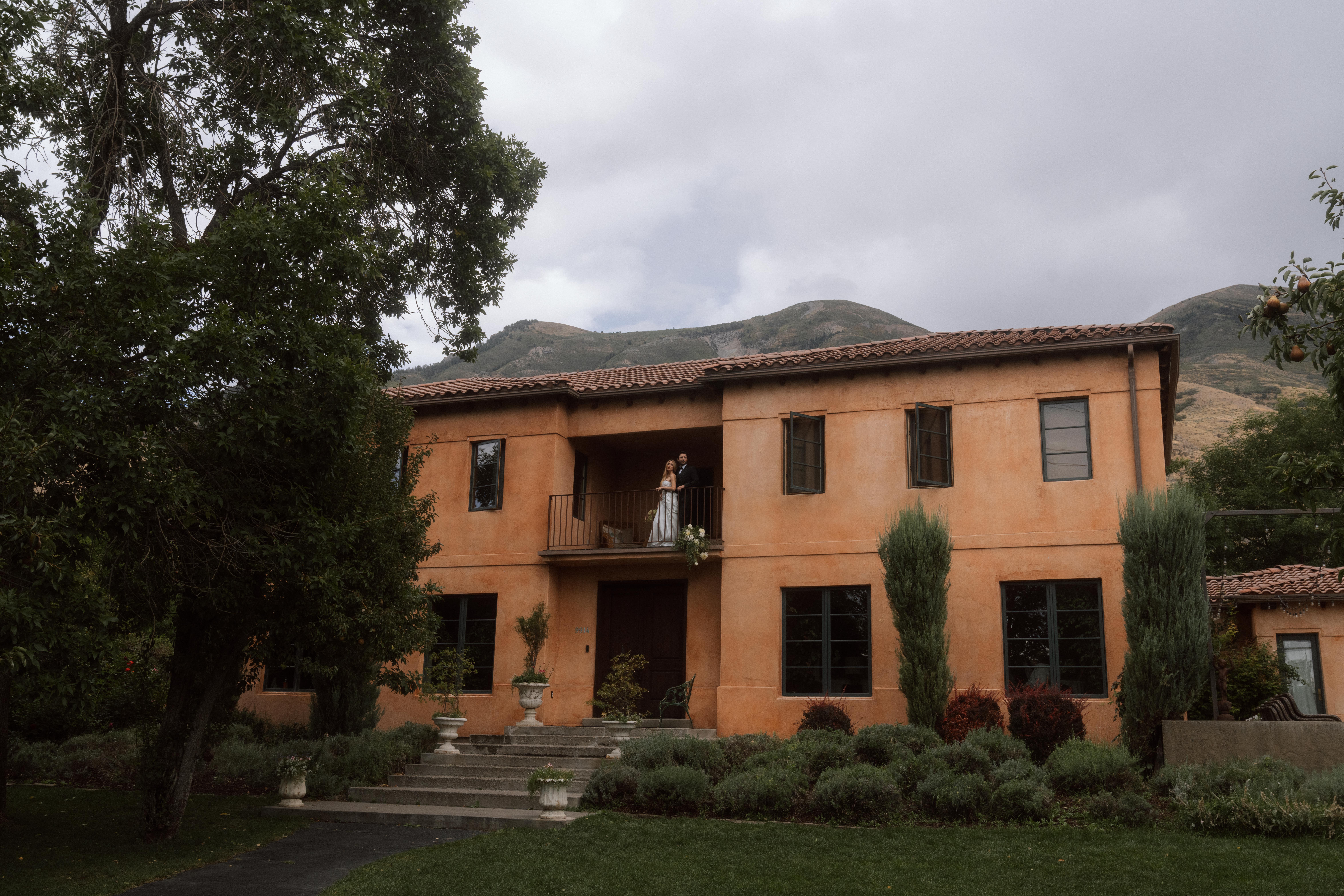 Elegant stone villa in the Tuscan countryside with cypress-lined driveway and sunset views
